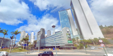 Foto de avenida do Bairro Belvedere, durante o dia.